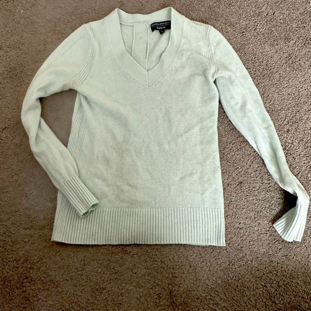 Cute blue sweater with fun button back